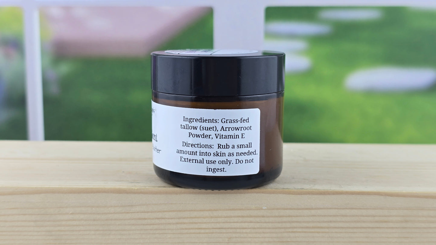 Side view of Black jar with a label on a wooden surface