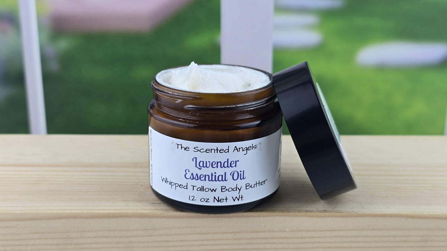 Jar of whipped lavender body butter on a wooden surface.
