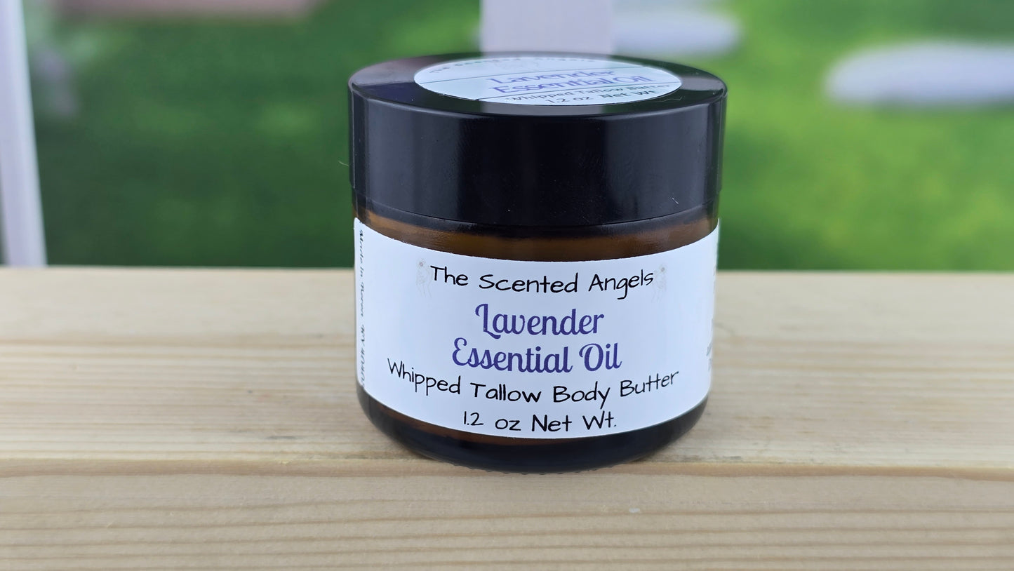Lavender essential oil whipped tallow body butter on a wooden surface.