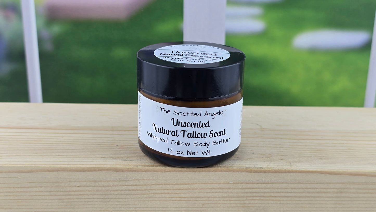 Natural tallow scent body butter on a wooden surface