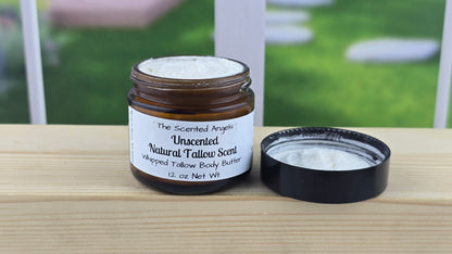 Jar and container of unscented whipped tallow body butter on a wooden surface.