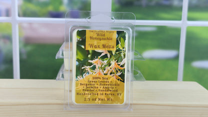 Wax melt packaging with floral design on a wooden surface