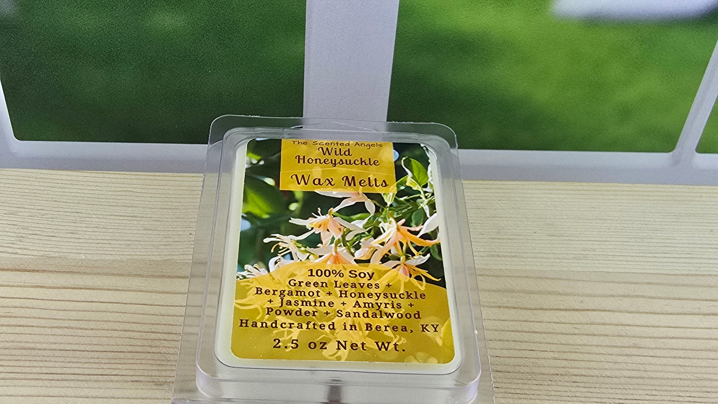 Wax melt packaging with floral design and text on a wooden surface