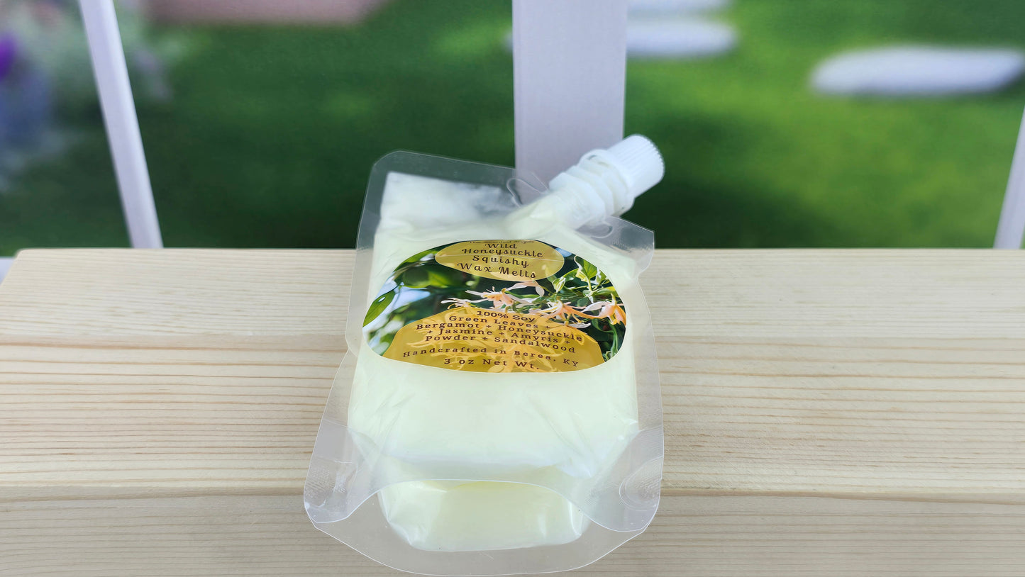 squeezable wax melt pouch laying flat on a wooden surface